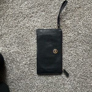 MK clutch, small scratch on back visible in picture